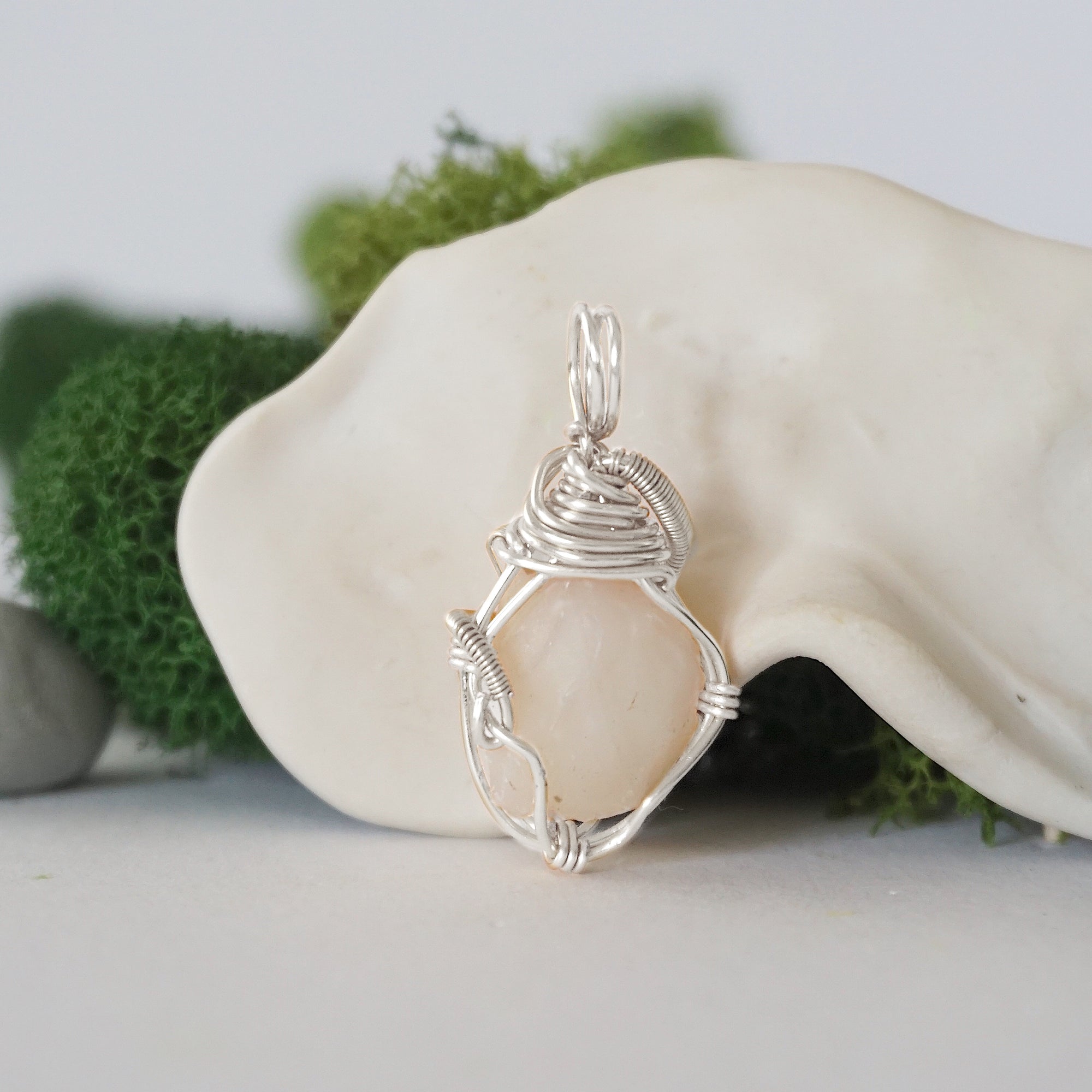 Back detail of silver wire wrapped opal and freshwater pearl pendant necklace, handcrafted gemstone jewelry
