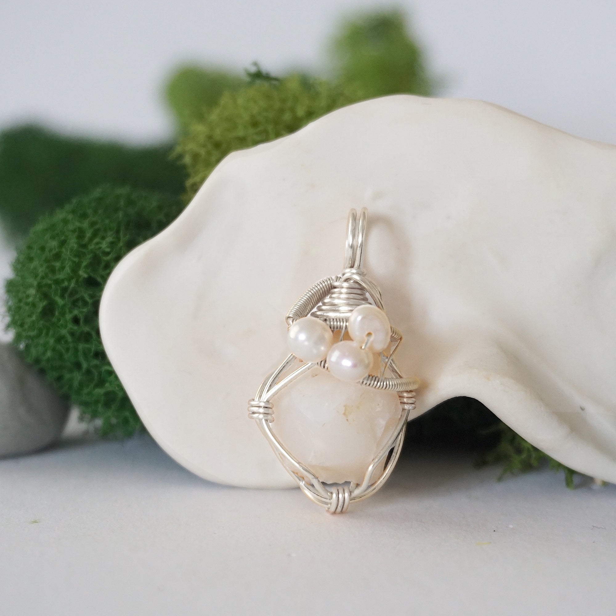 Detailed front view of silver wire wrapped opal and freshwater pearl pendant, unique artisan necklace
