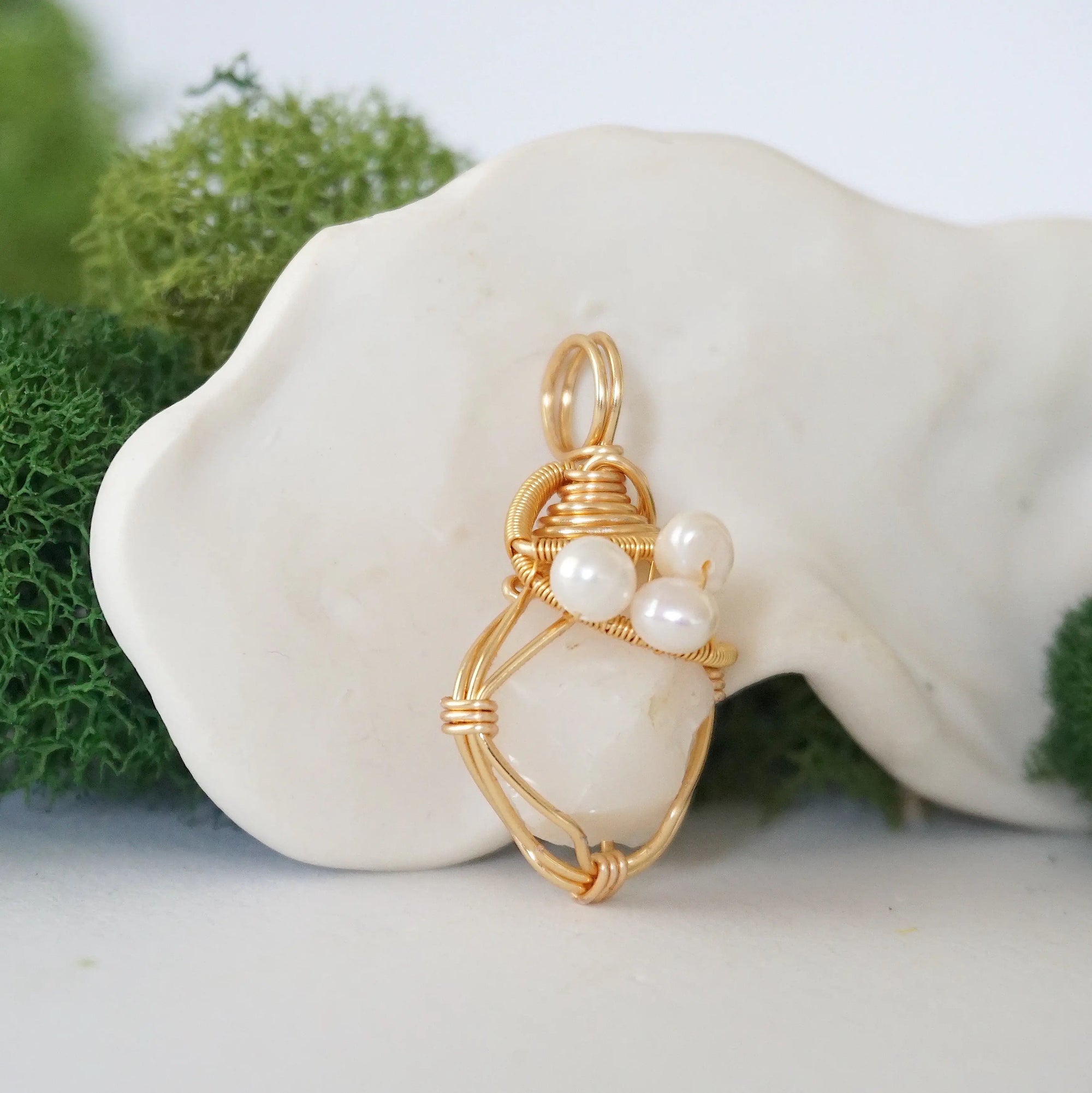 Side angle detail of opal and freshwater pearl pendant, gold wire wrapped, ethical artisan necklace