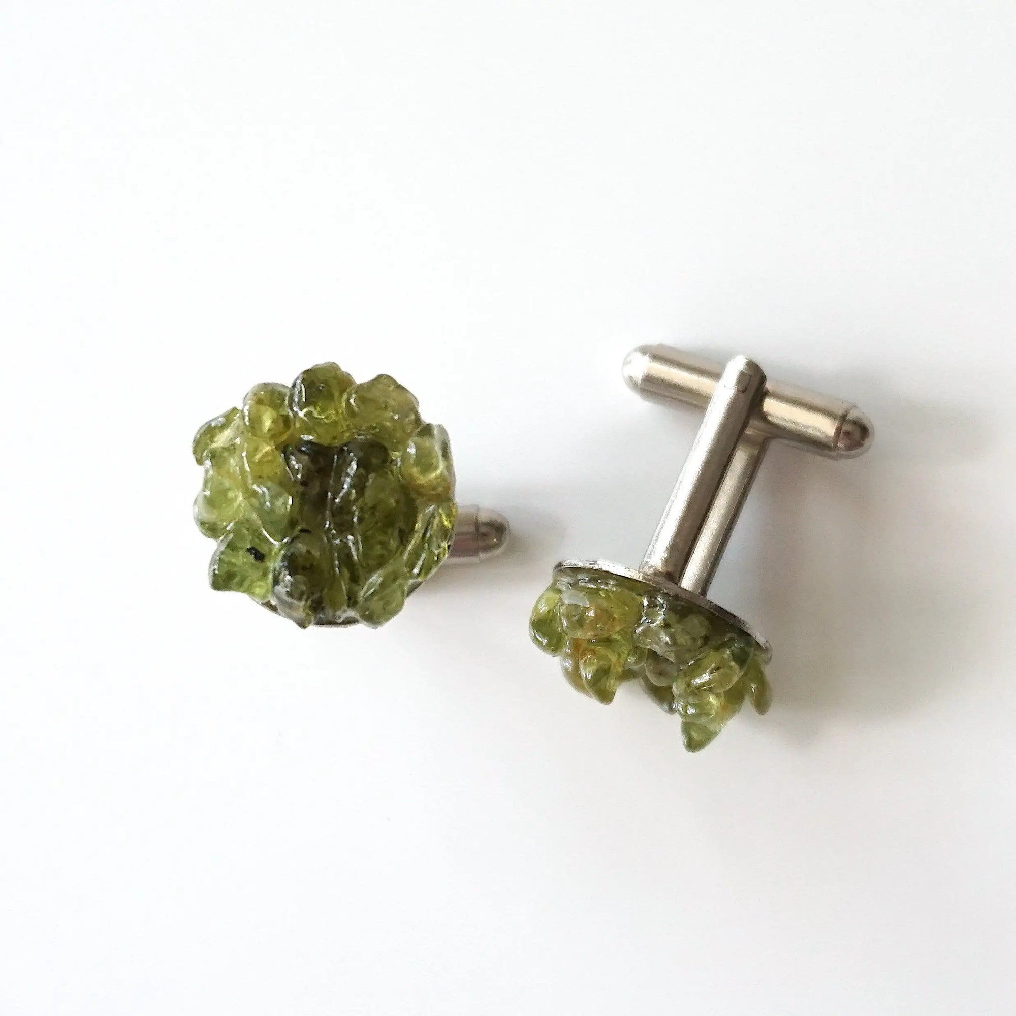 Top view of peridot cufflinks for men — genuine raw peridot stone cluster in white gold finish setting, natural olive green crystal, August birthstone handmade jewelry