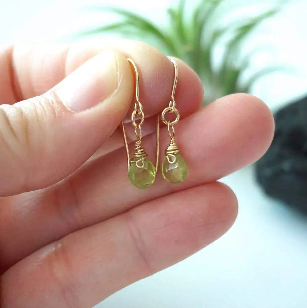 Peridot drop earrings in hand for size reference, genuine faceted peridot, 14k gold filled