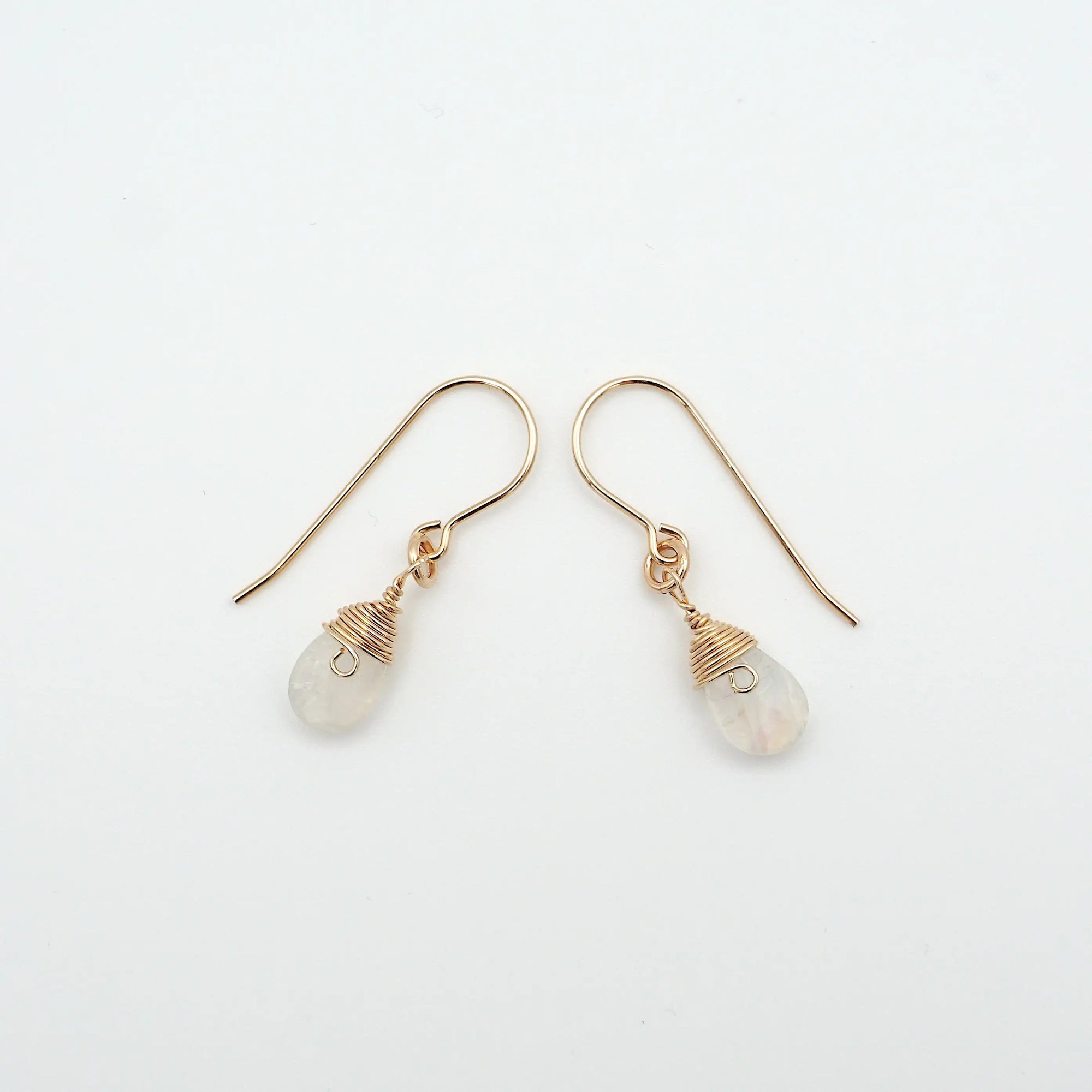 Side angle of rainbow moonstone drop earrings, minimalist artisan wire wrapping, 14k gold filled
