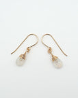 Side angle of rainbow moonstone drop earrings, minimalist artisan wire wrapping, 14k gold filled
