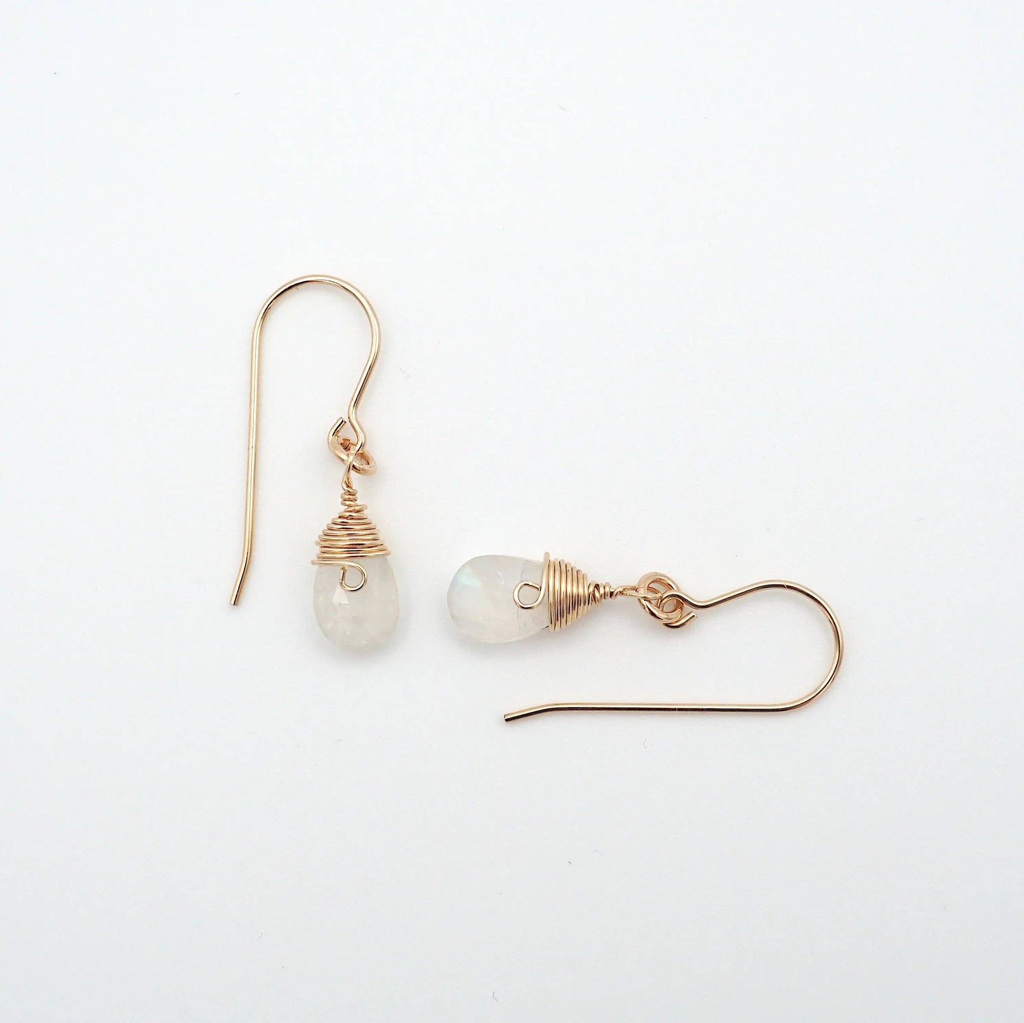 Side angle of rainbow moonstone drop earrings, minimalist artisan wire wrapping, 14k gold filled
