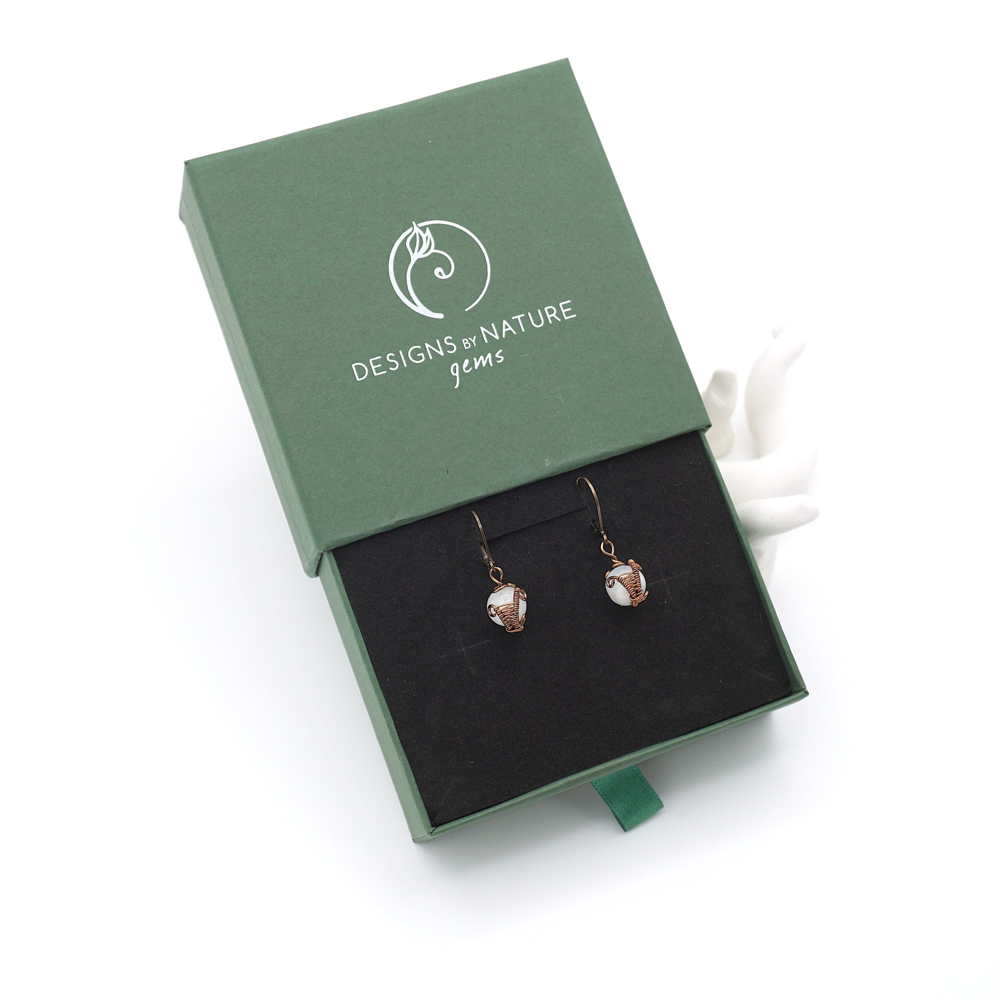 Rainbow moonstone drop earrings presented in a branded gift box, ready for gifting, with antique bronze copper wire wrapping.