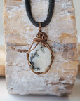 Back view of rainbow moonstone pendant necklace showing secure handcrafted antique bronze copper wire wrapping