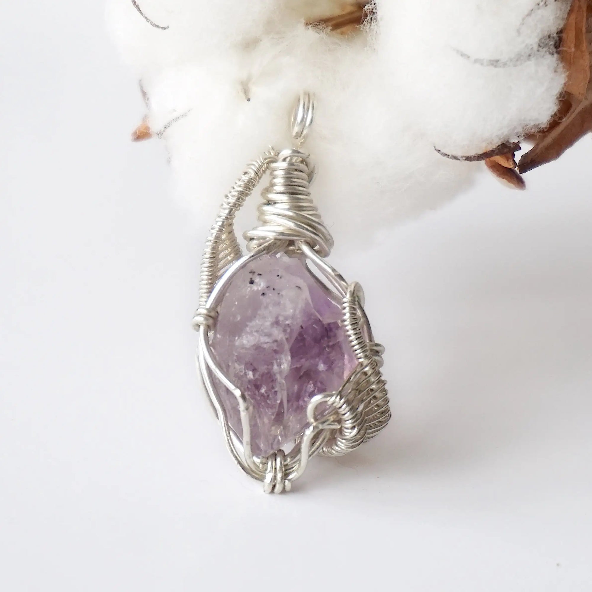 Back side angle of raw amethyst pendant, natural amethyst crystal, sterling silver artisan wire wrap