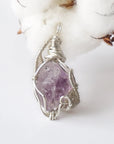 Back side angle of raw amethyst pendant, natural amethyst crystal, sterling silver artisan wire wrap
