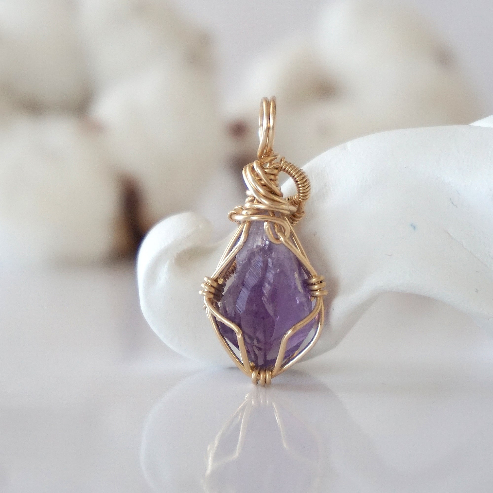 Back view of raw amethyst pendant in 14k gold filled, highlighting stone and wire detail. One of a kind February birthstone jewelry by Designs by Nature Gems.