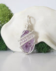 Back view of raw amethyst necklace pendant with handcrafted sterling silver wire work
