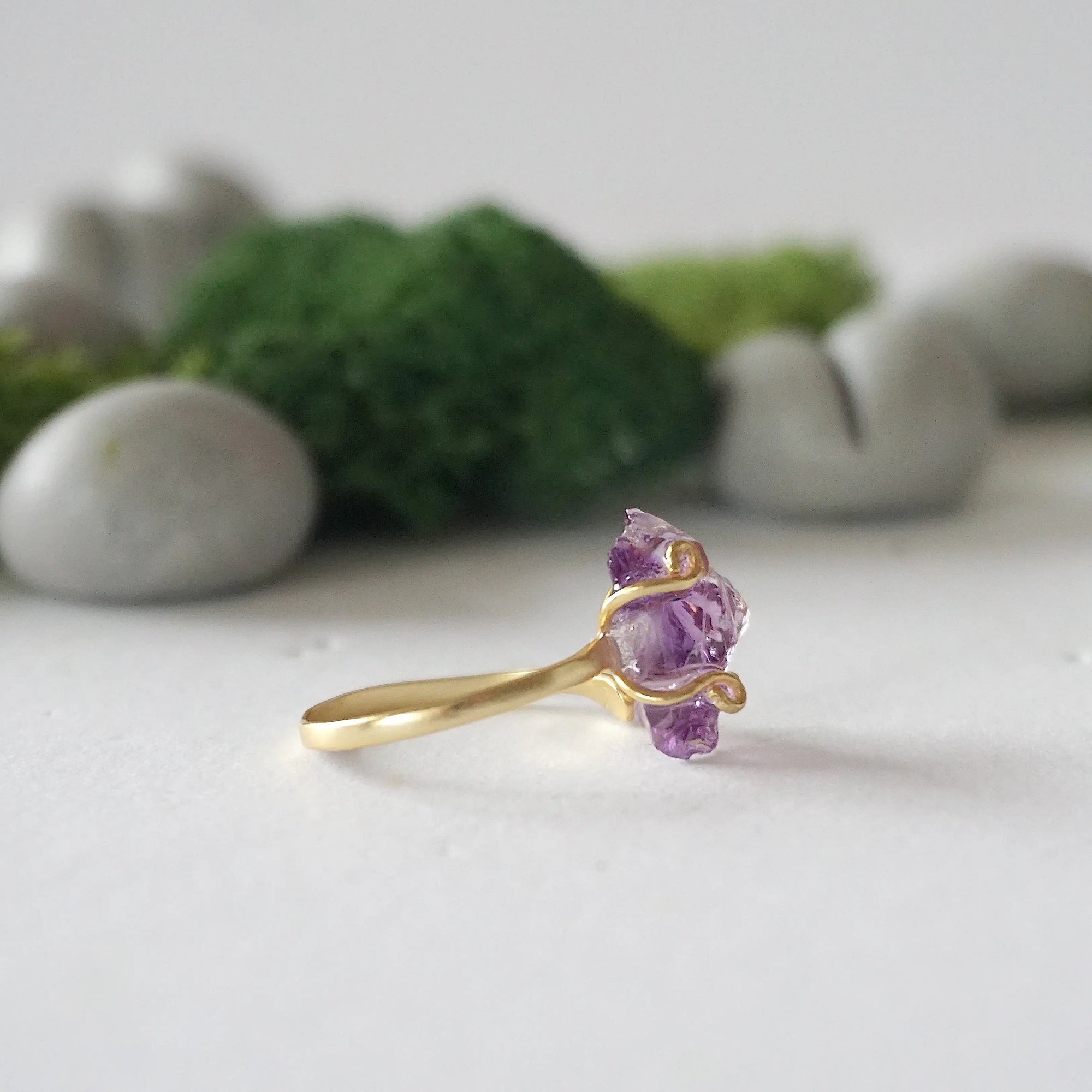 Alt text: Right side detail of raw amethyst ring in 14k gold vermeil claw setting, natural crystal birthstone ring