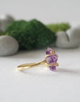 Alt text: Right side detail of raw amethyst ring in 14k gold vermeil claw setting, natural crystal birthstone ring