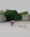 Left side detail of raw amethyst crystal ring in sterling silver claw setting, adjustable women’s ring