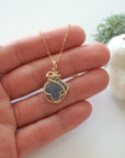 Raw aquamarine necklace in 14k gold filled shown in hand for size reference. Artisan March birthstone pendant by Designs by Nature Gems.