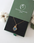 Raw aquamarine necklace in 14k gold filled displayed in branded Designs by Nature Gems jewelry box. Artisan March birthstone gift for women.