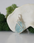 Left side detail of handmade raw aquamarine necklace — artisan wire wrapped 925 sterling silver pendant, natural aquamarine stone, ethically sourced crystal jewelry