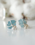 Back view of raw aquamarine stud earrings, showing prong setting and earring closure, sterling silver