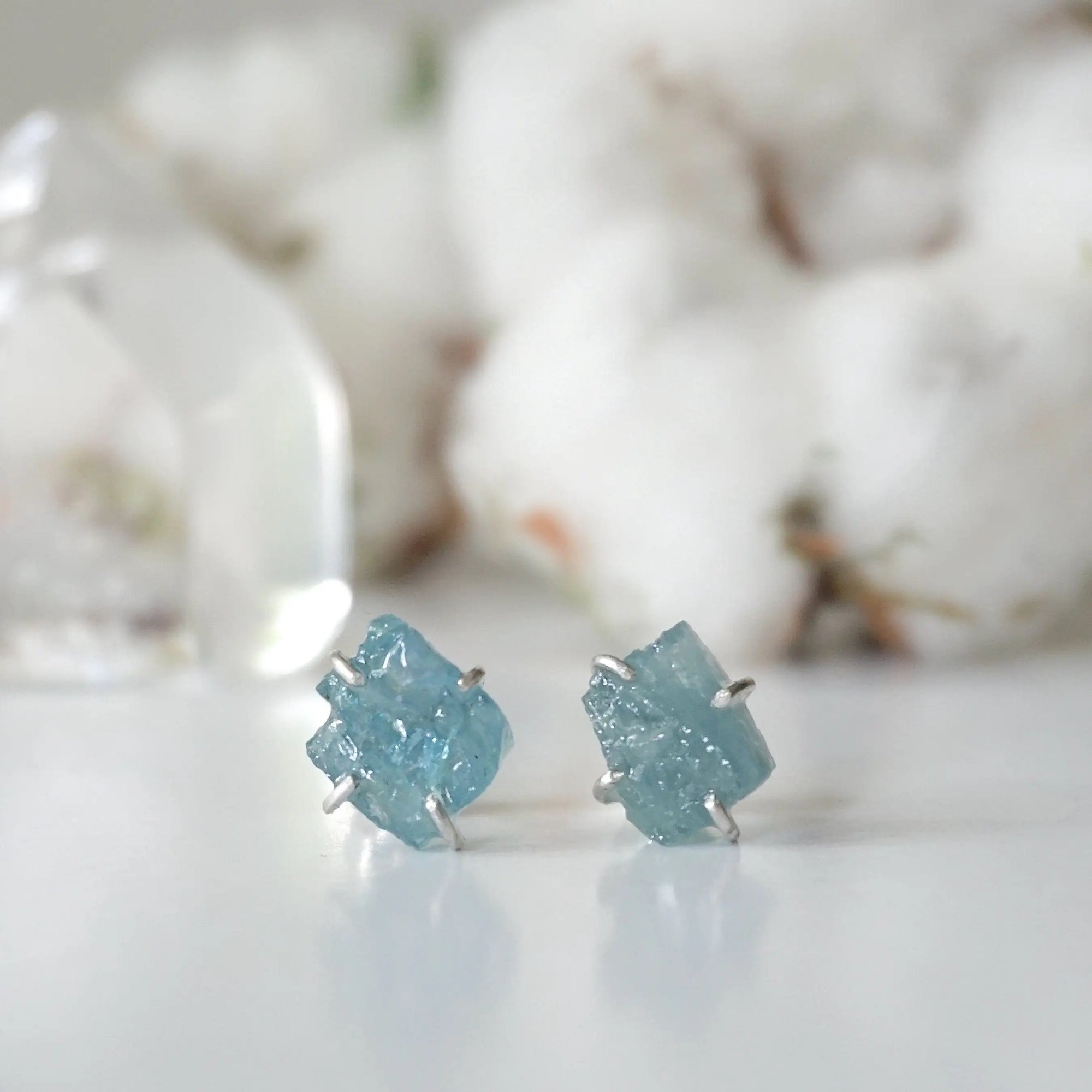 Raw aquamarine stud earrings, detailed front angle, genuine gemstone in 925 sterling silver prong setting, Designs by Nature Gems