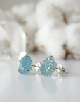 Left side angle of raw aquamarine stud earrings, genuine gemstone in 925 sterling silver, Designs by Nature Gems
