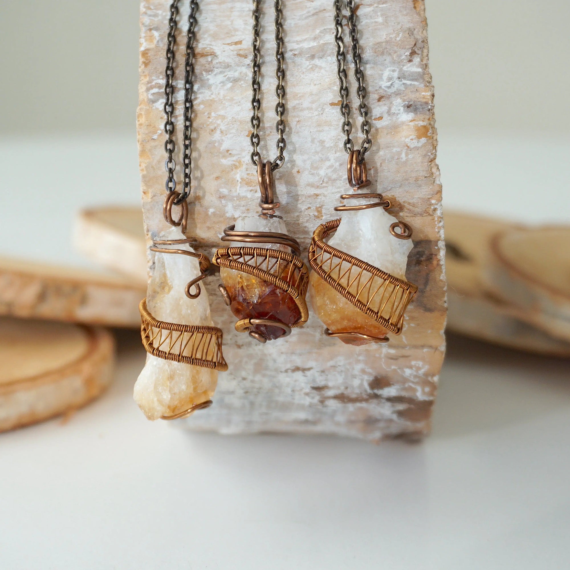 Three raw citrine necklaces antique bronze showing natural stone size shape and color variation unisex jewelry

