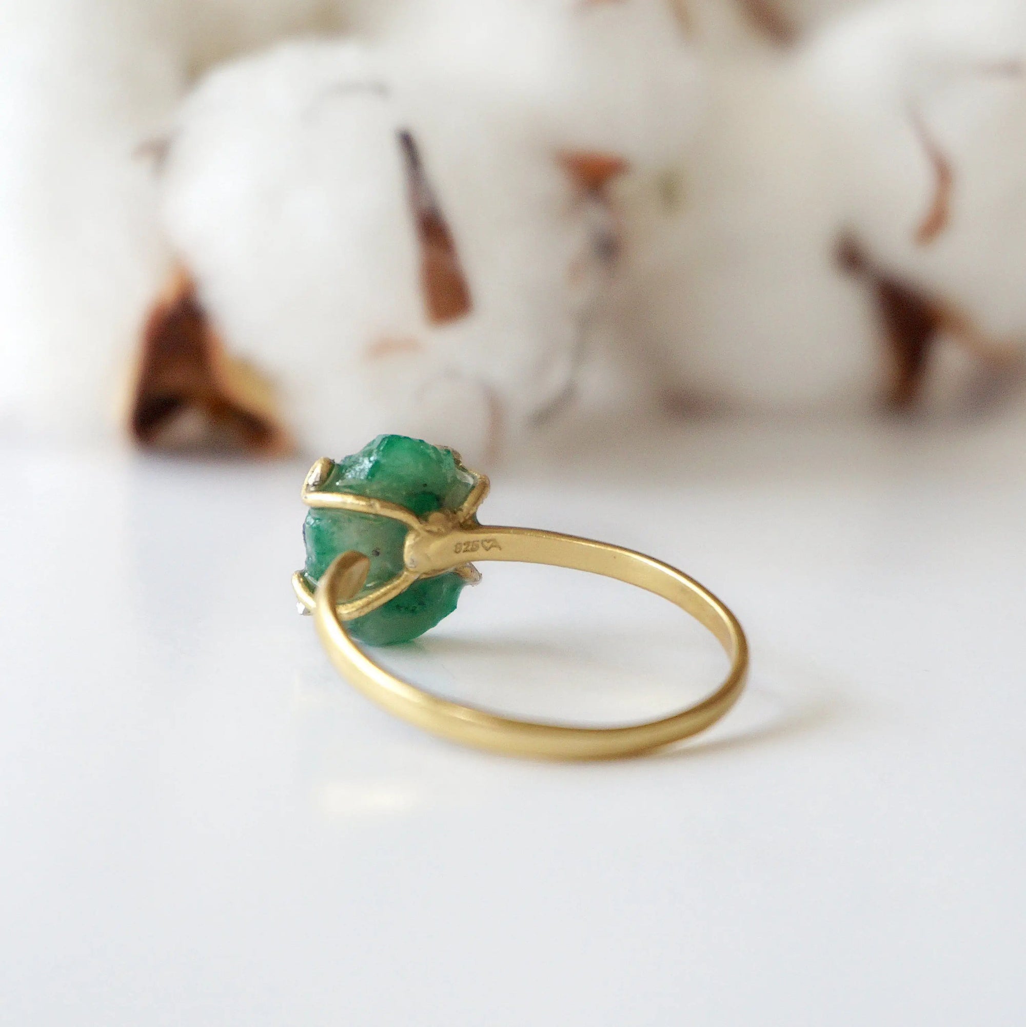 Back view of adjustable gold vermeil emerald ring showing ring band and handcrafted setting details
