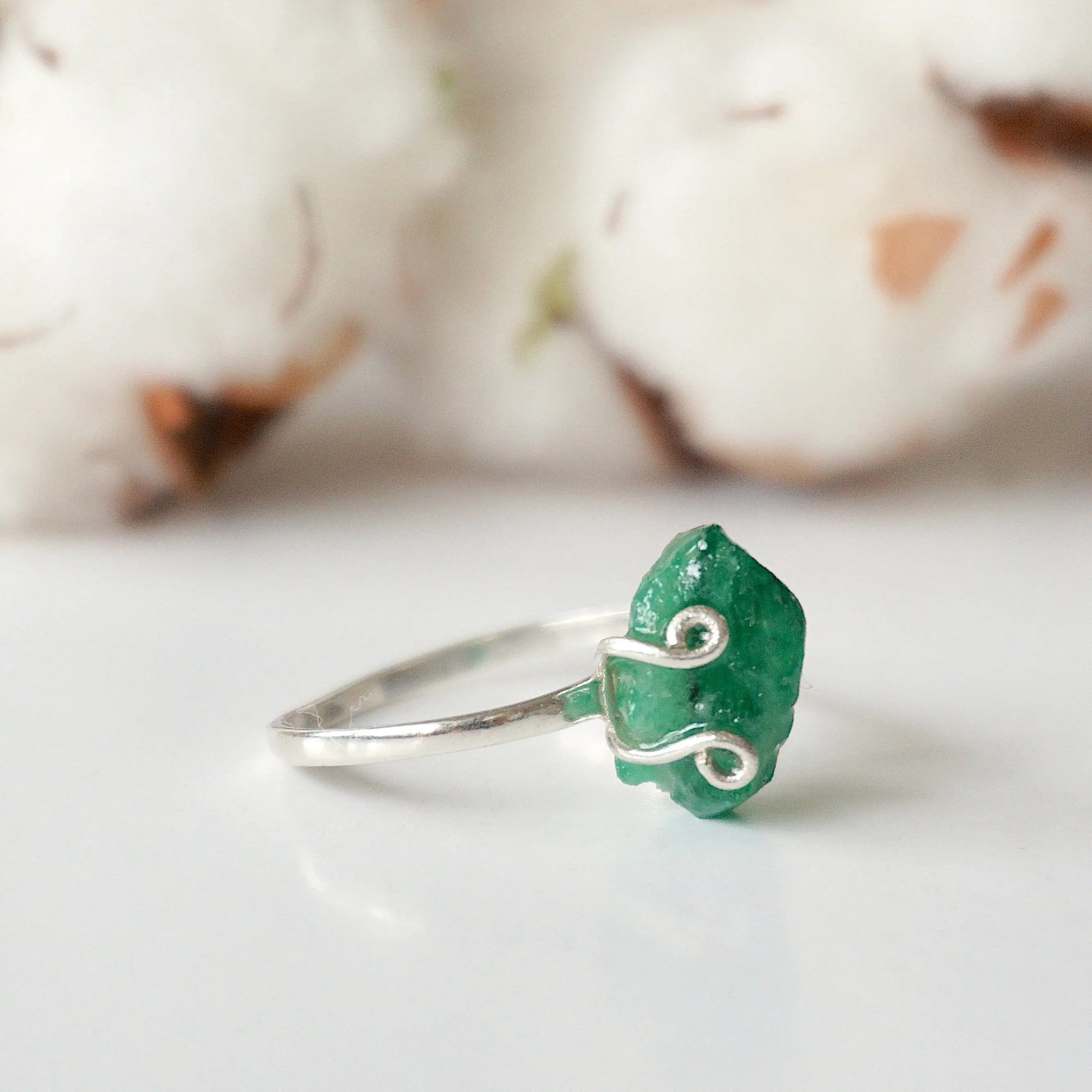 Right side detail of natural raw emerald ring in sterling silver with adjustable artisan ring design