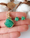 Raw emerald necklace and stud earrings set in 14k gold filled shown in hand for size reference. Artisan May birthstone jewelry set by Designs by Nature Gems.