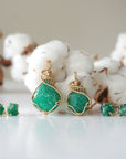 Two raw emerald jewelry sets in 14k gold filled, showing natural variation in size, shape, and color. Handcrafted May birthstone jewelry set by Designs by Nature Gems.