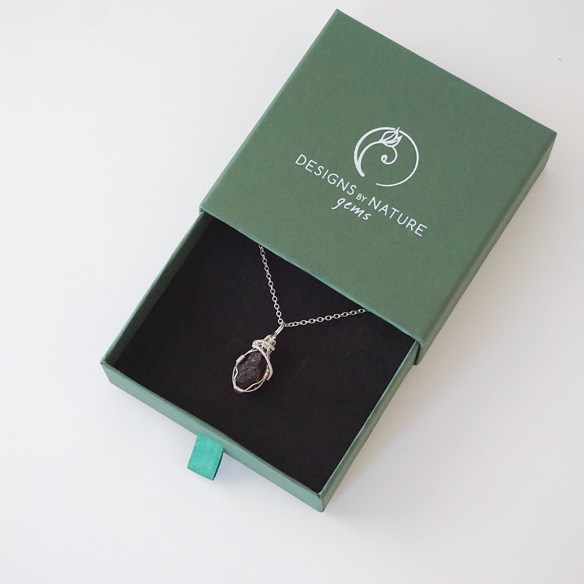 Raw garnet crystal necklace in 925 sterling silver presented in gift box by Designs by Nature Gems