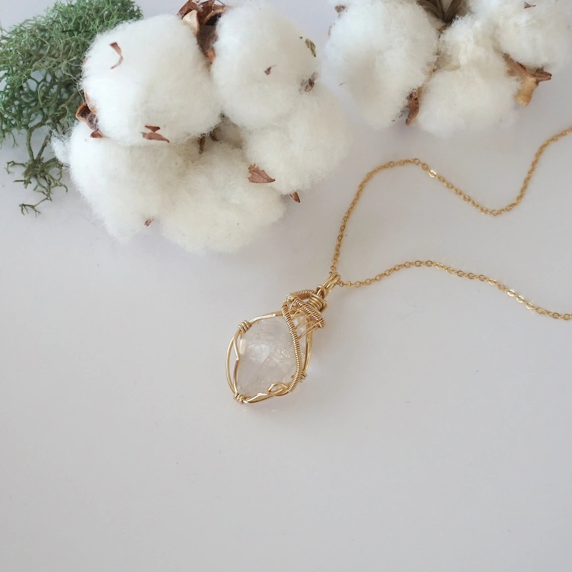 Raw Herkimer diamond necklace in 14k gold filled laying flat. Handcrafted April birthstone jewelry for women by Designs by Nature Gems.