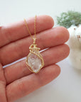 Raw Herkimer diamond necklace in 14k gold filled shown in hand for size reference. Artisan April birthstone pendant by Designs by Nature Gems.