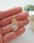 Raw Herkimer diamond necklace in 14k gold filled shown in hand for size reference. Artisan April birthstone pendant by Designs by Nature Gems.