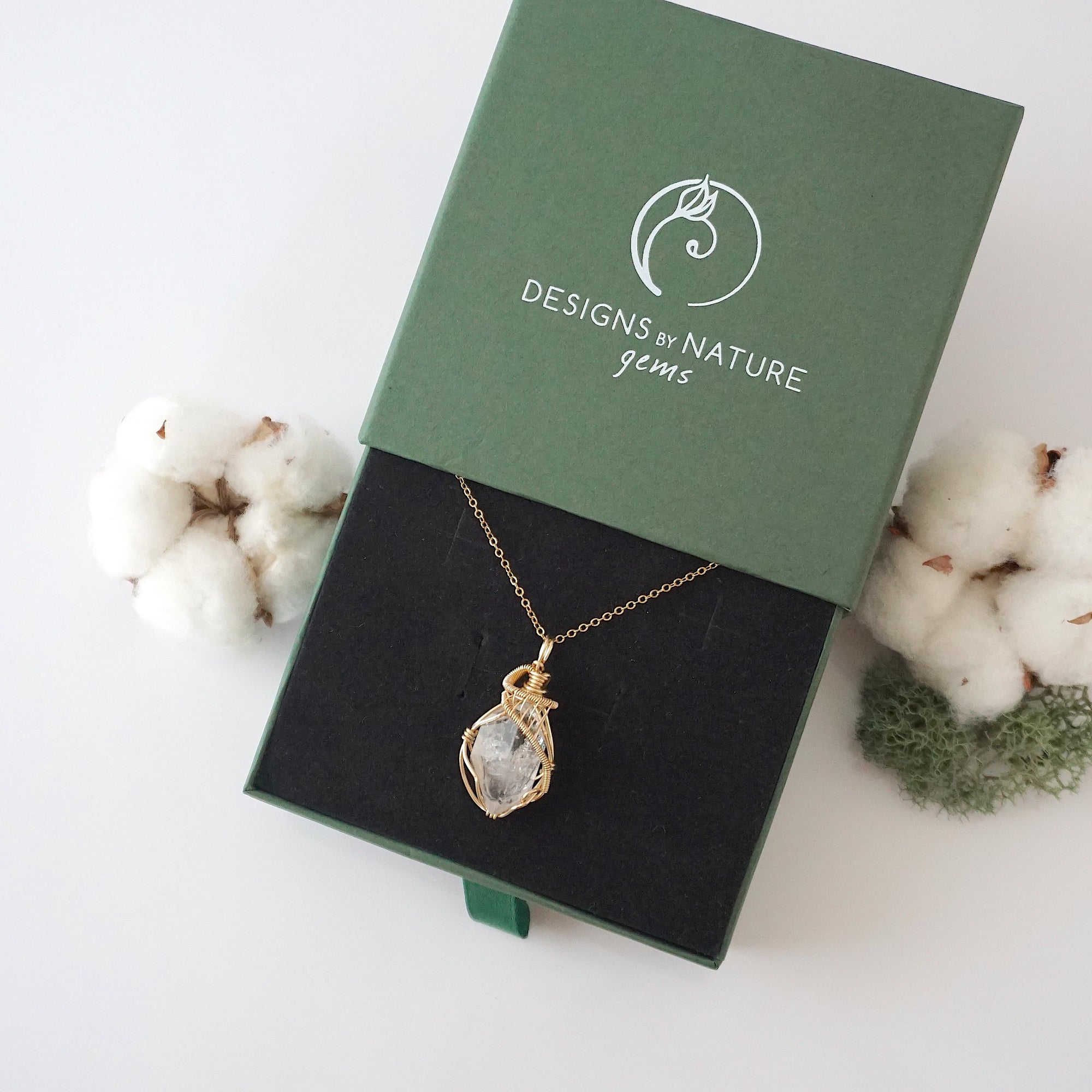 Raw Herkimer diamond necklace in 14k gold filled displayed in branded Designs by Nature Gems jewelry box. Artisan April birthstone gift for women.