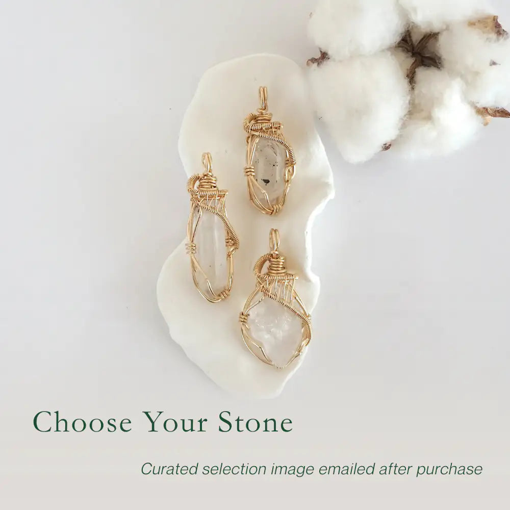 Three raw Herkimer diamond pendants in 14k gold filled, showing natural variation in size, shape, and clarity. Handcrafted April birthstone jewelry by Designs by Nature Gems.