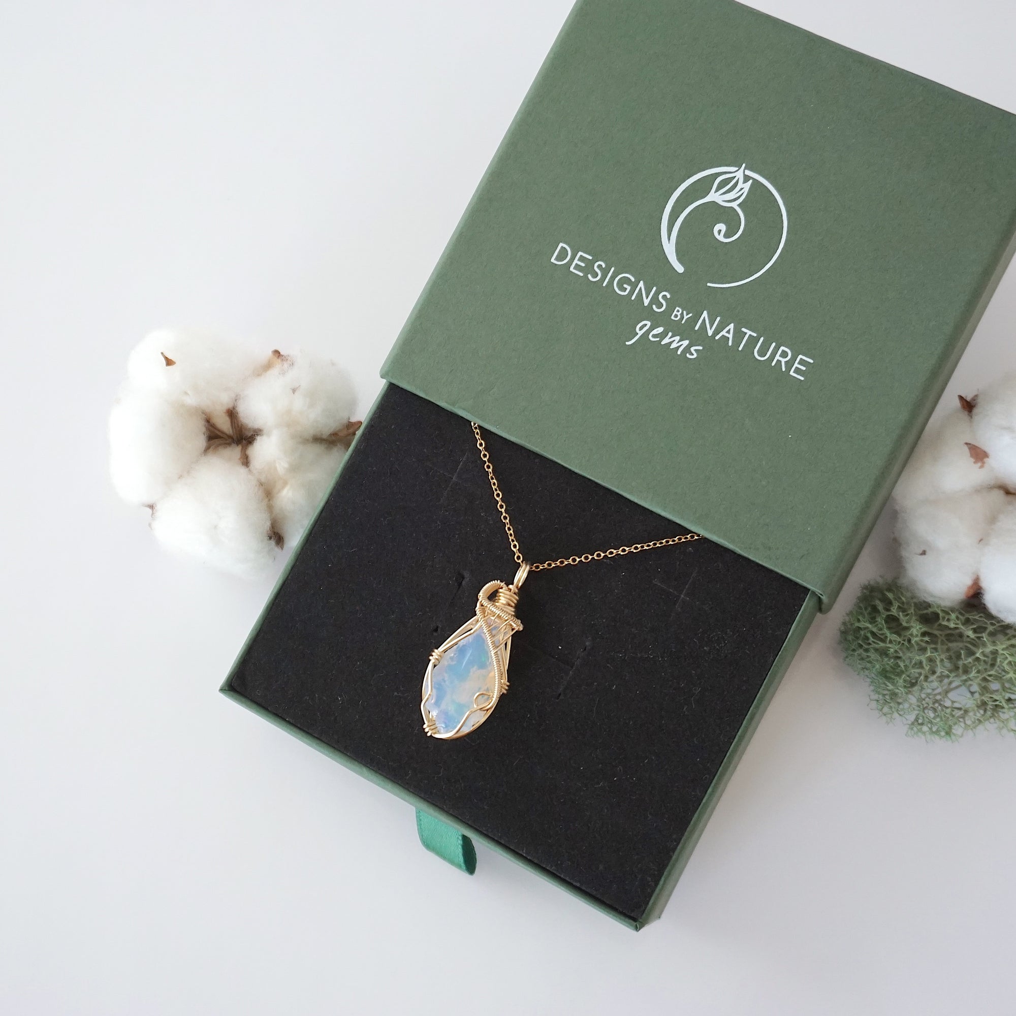 Raw opal necklace in 14k gold filled displayed in branded Designs by Nature Gems jewelry box. Artisan October birthstone gift for women.