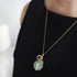 Raw opal necklace in 14k gold filled on a female model. Handcrafted October birthstone jewelry for women by Designs by Nature Gems.