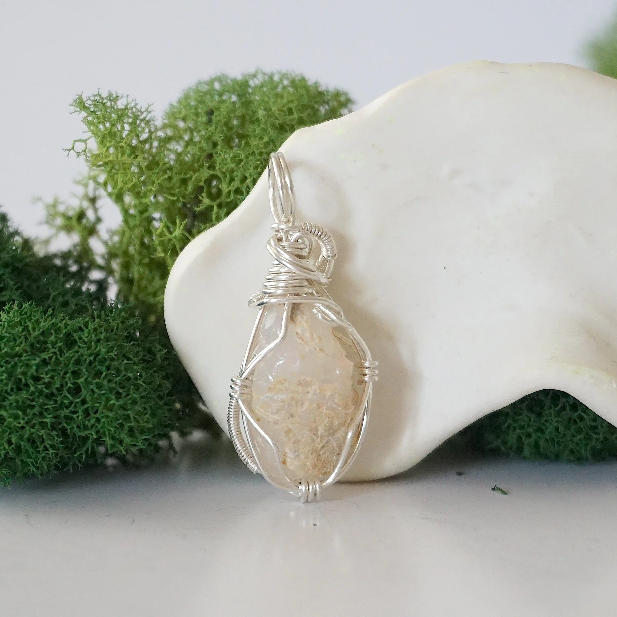 Back view of raw opal wire wrapped pendant — 925 sterling silver hand-wrapped setting, shows craftsmanship and secure stone hold, handmade in Toronto Canada