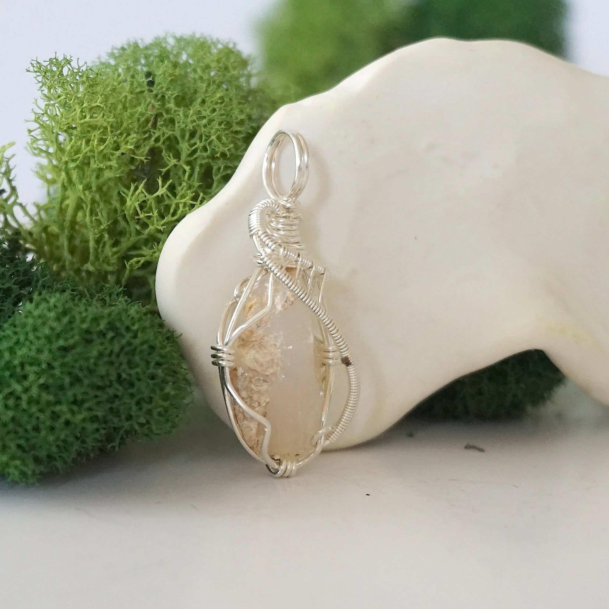 Right side detail of raw opal crystal pendant — intricate 925 sterling silver wire weaving technique, handcrafted artisan wire wrapped jewelry, Designs by Nature Gems