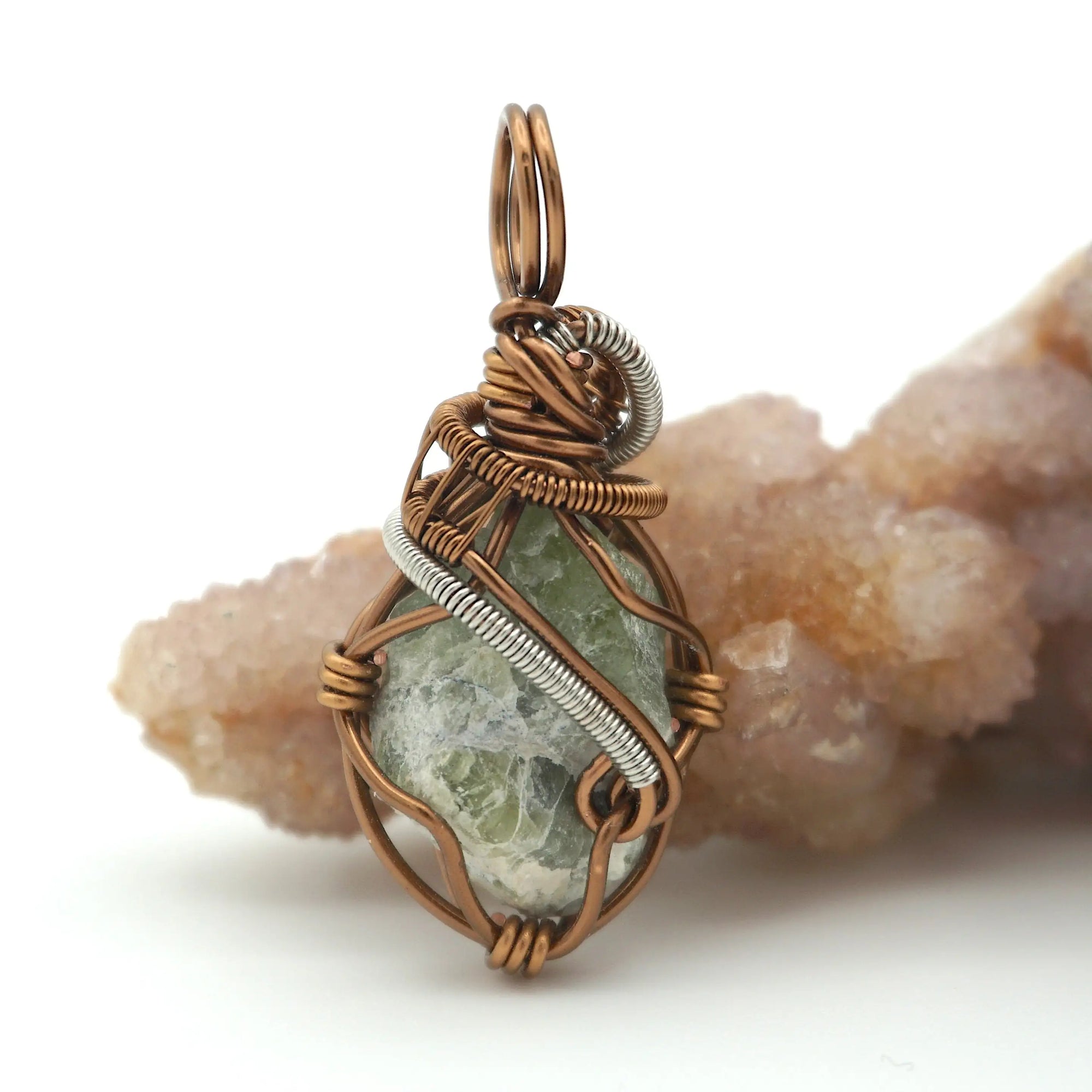 Back view of raw peridot wire wrapped pendant — antique bronze and dark silver copper wire weave detail, handcrafted artisan crystal necklace for women