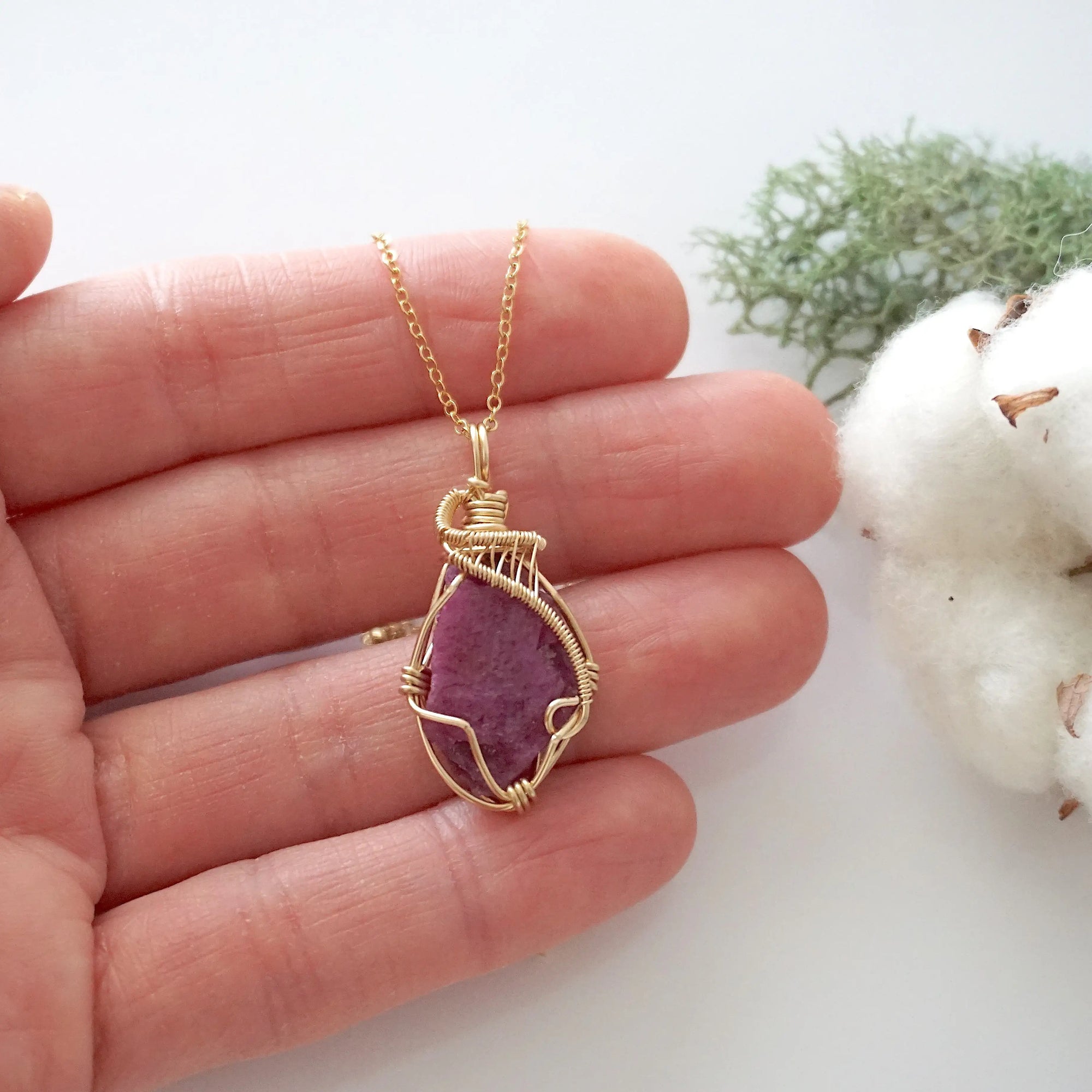 Raw pink ruby necklace in 14k gold filled shown in hand for size reference. Artisan July birthstone pendant by Designs by Nature Gems.