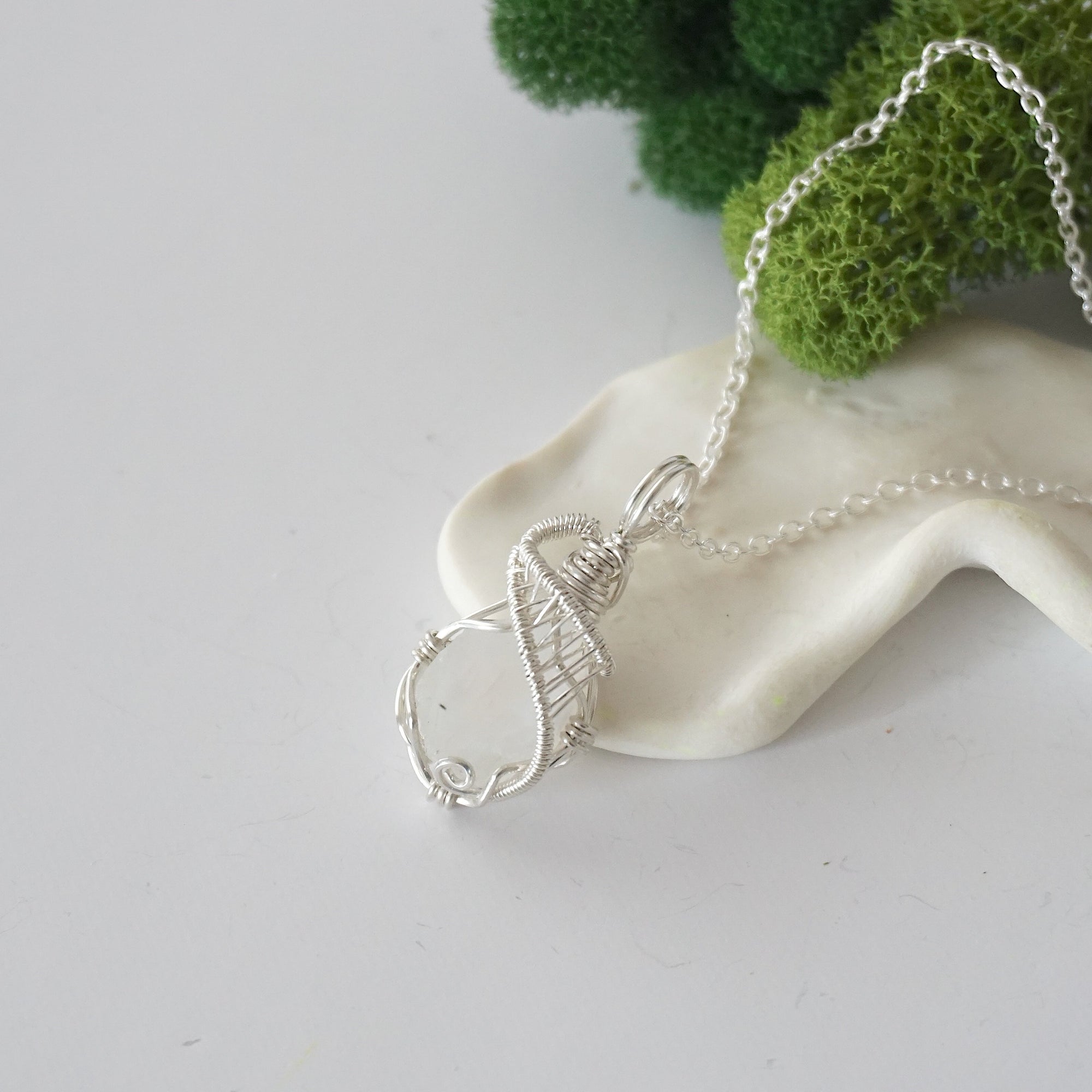 Raw rainbow moonstone necklace with 925 sterling silver wire wrapped pendant on silver chain