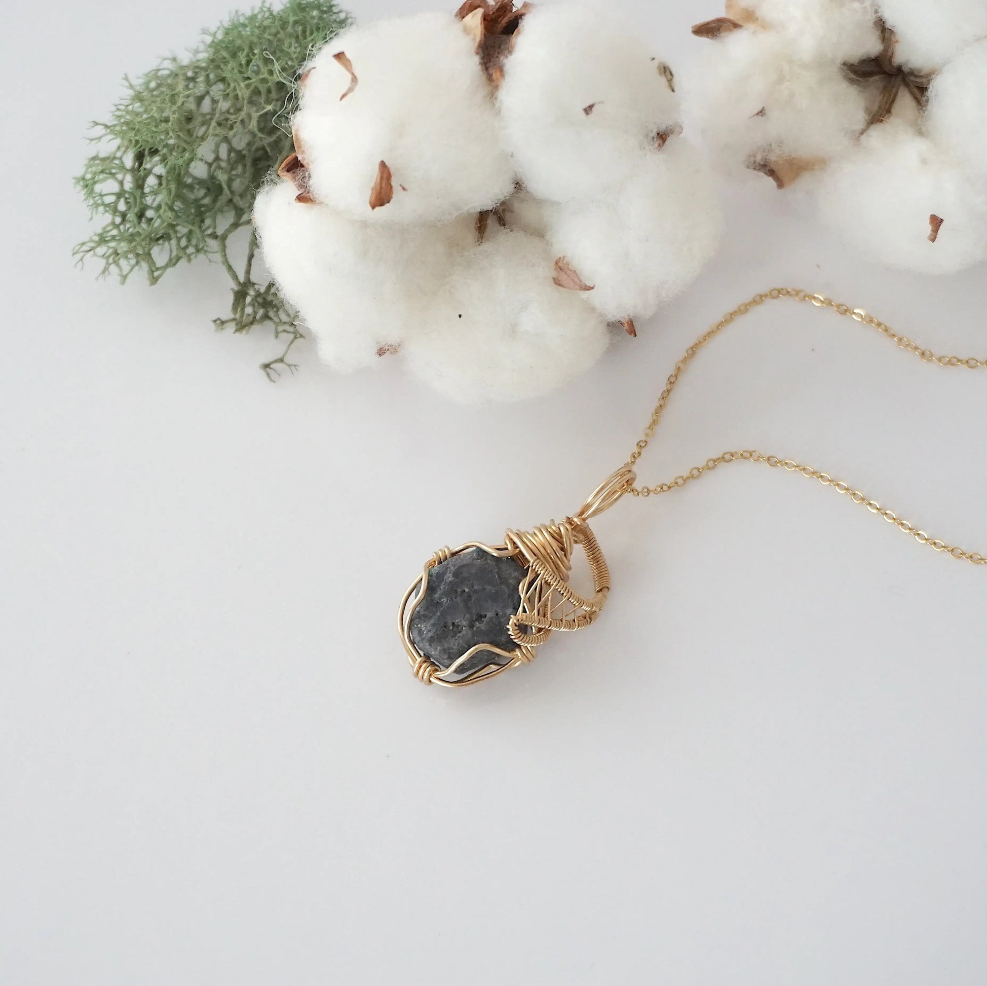 Raw sapphire necklace in 14k gold filled laying flat. Handcrafted September birthstone jewelry for women by Designs by Nature Gems.