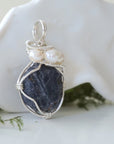 Right-angle detail of raw sapphire and freshwater pearl pendant showing artisan sterling silver wire-wrapping — handcrafted September and June birthstone necklace