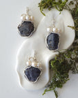 Three raw sapphire and pearl pendants showing natural variation in sapphire size, shape, and depth of colour — each sterling silver wire-wrapped necklace is individually handcrafted and one of a kind