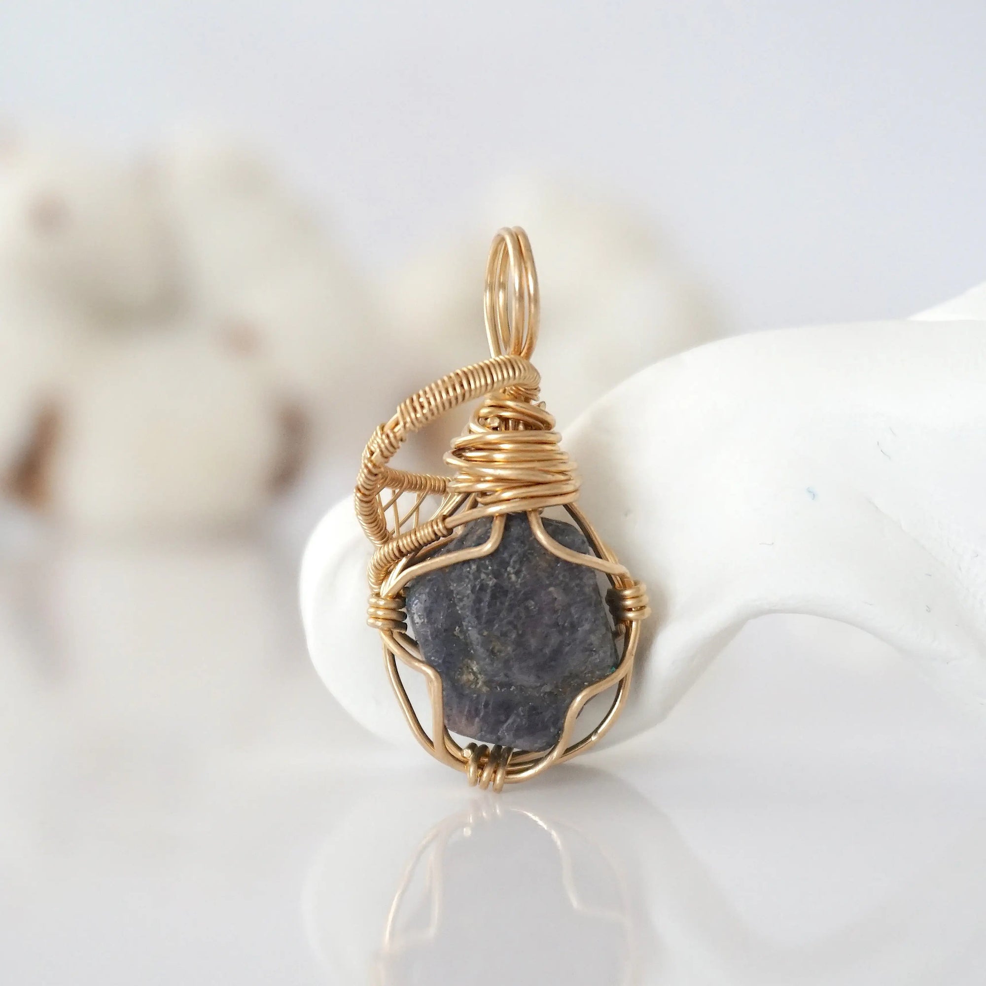 Back view of raw sapphire pendant in 14k gold filled, highlighting stone and wire detail. One of a kind September birthstone jewelry by Designs by Nature Gems.