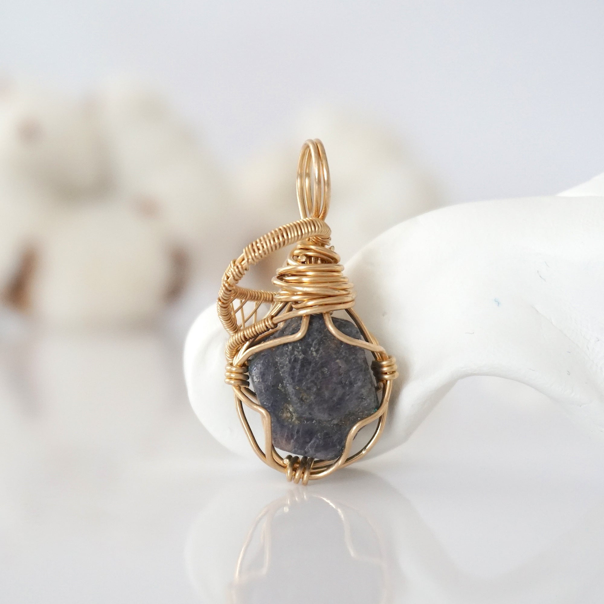 Back view of raw sapphire pendant in 14k gold filled, highlighting stone and wire detail. One of a kind September birthstone jewelry by Designs by Nature Gems.