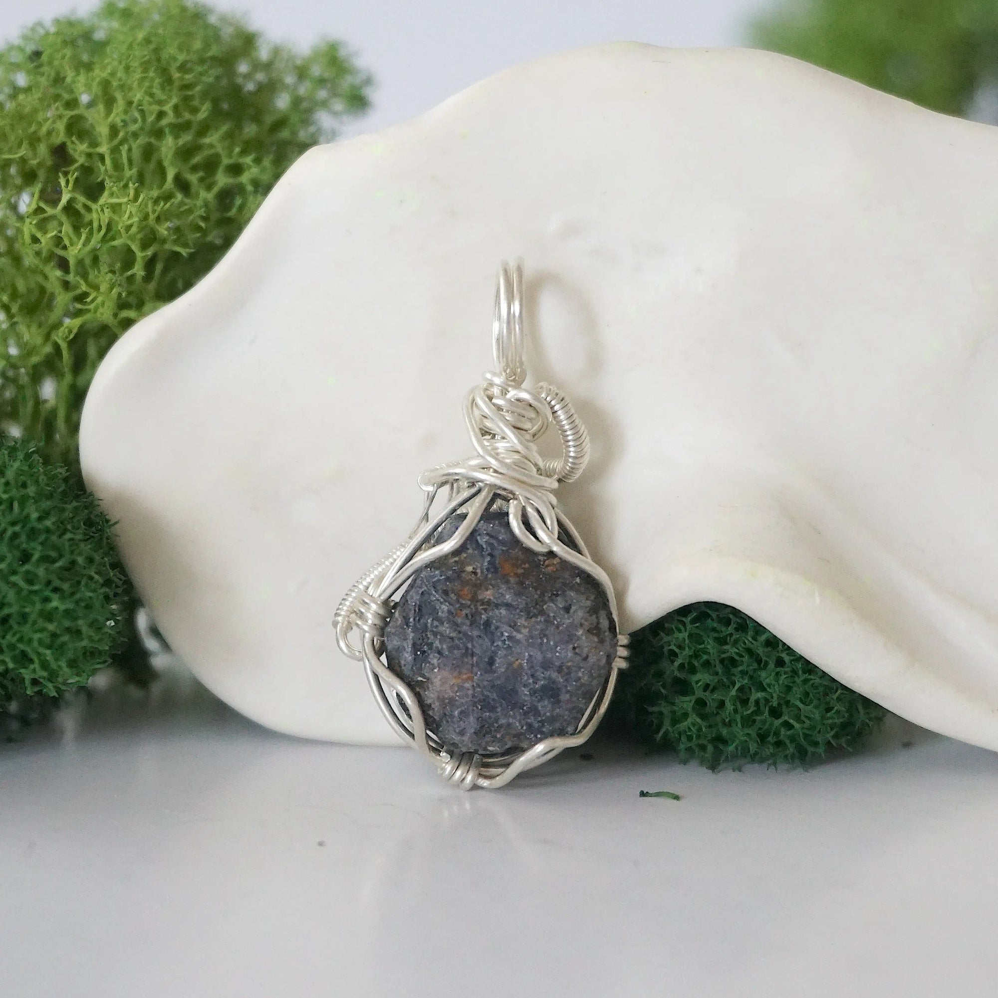 Back view of raw sapphire wire wrapped pendant — 925 sterling silver hand-wrapped setting, shows craftsmanship and secure stone hold, handmade in Toronto Canada