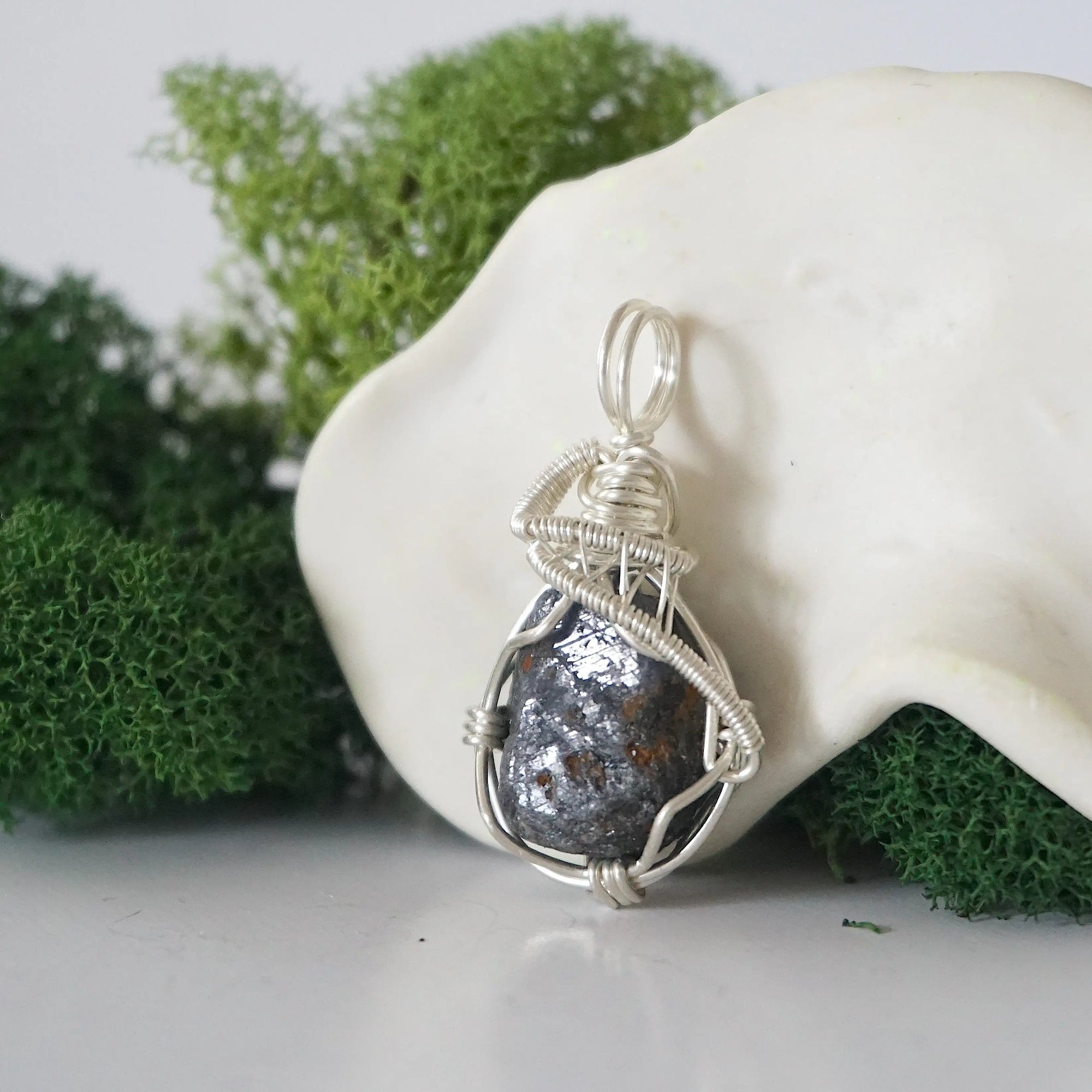Left side detail of handmade raw sapphire necklace — artisan wire wrapped 925 sterling silver pendant, natural sapphire stone, ethically sourced crystal jewelry