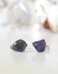 Front view of natural raw sapphire stud earrings showing their unique blue colour and minimalist 925 sterling silver setting