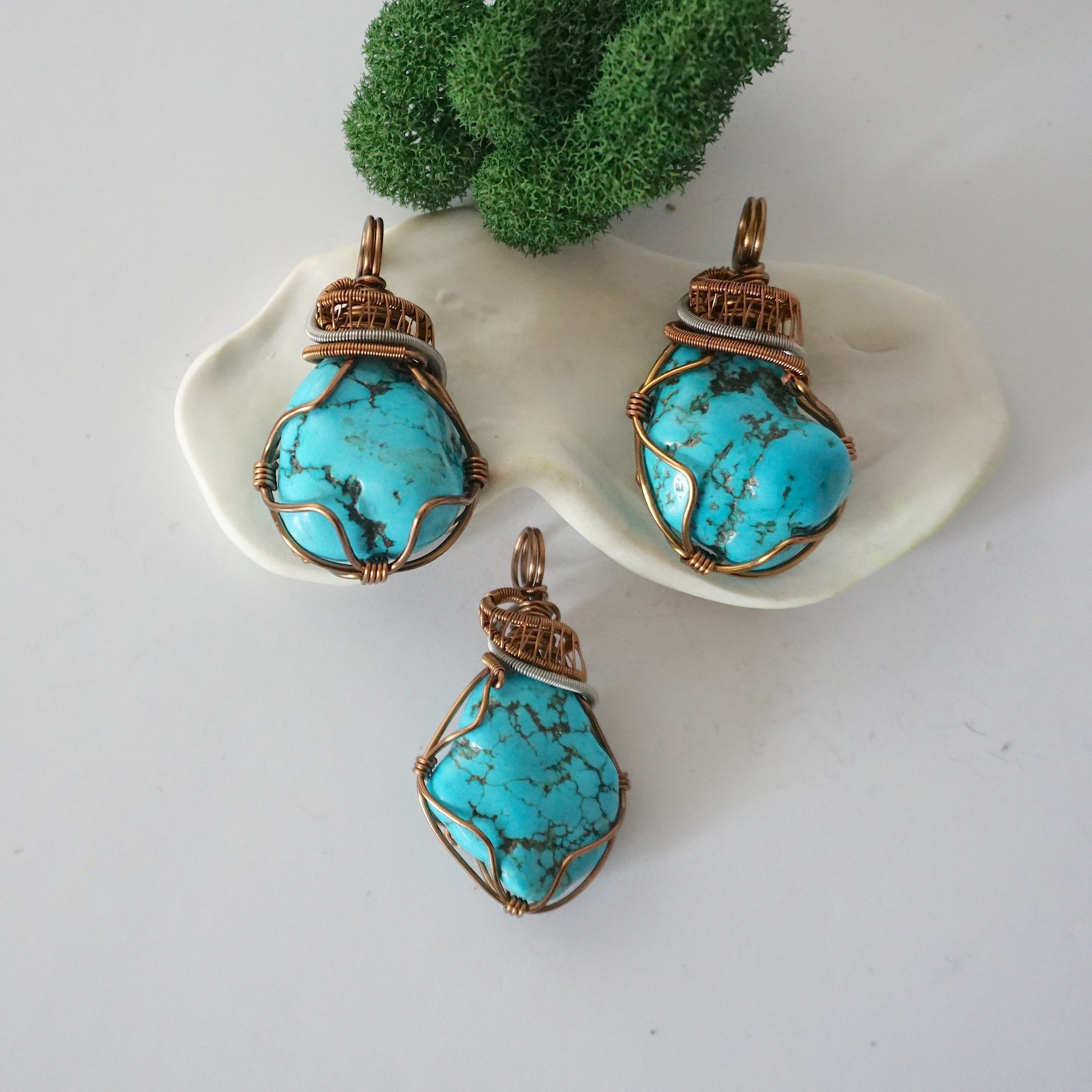 Three raw turquoise necklace variations showing natural stone differences, detailed handmade wire wrapped pendants